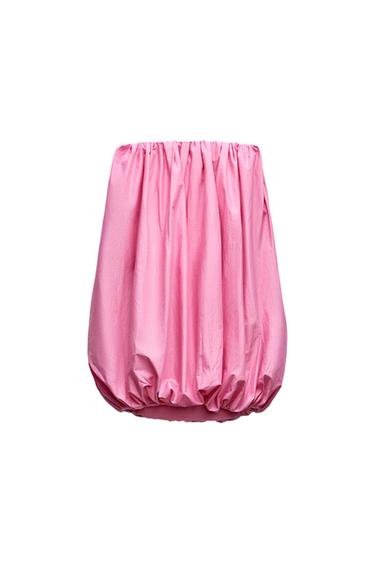 Pink skirt with a puffed design and pleats, white background.