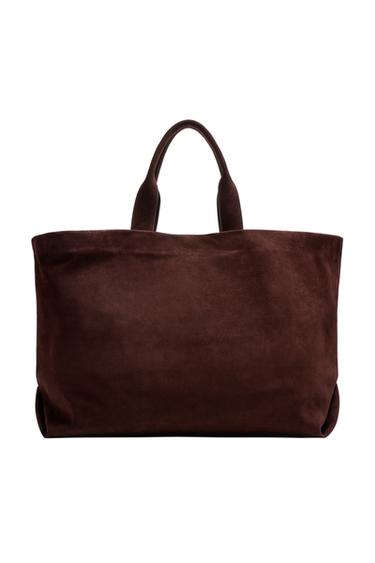 Front view of brown handbag with top handles.