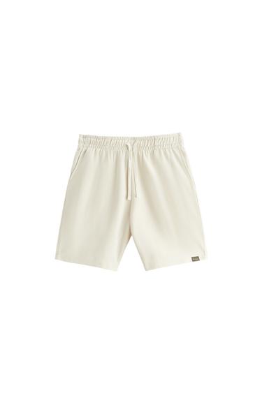 TEXTURED BERMUDA SHORTS WITH LABEL