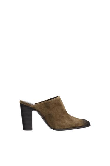 Brown suede slingback block-heel shoes with a pointed toe and darkened toe detail on a white background.