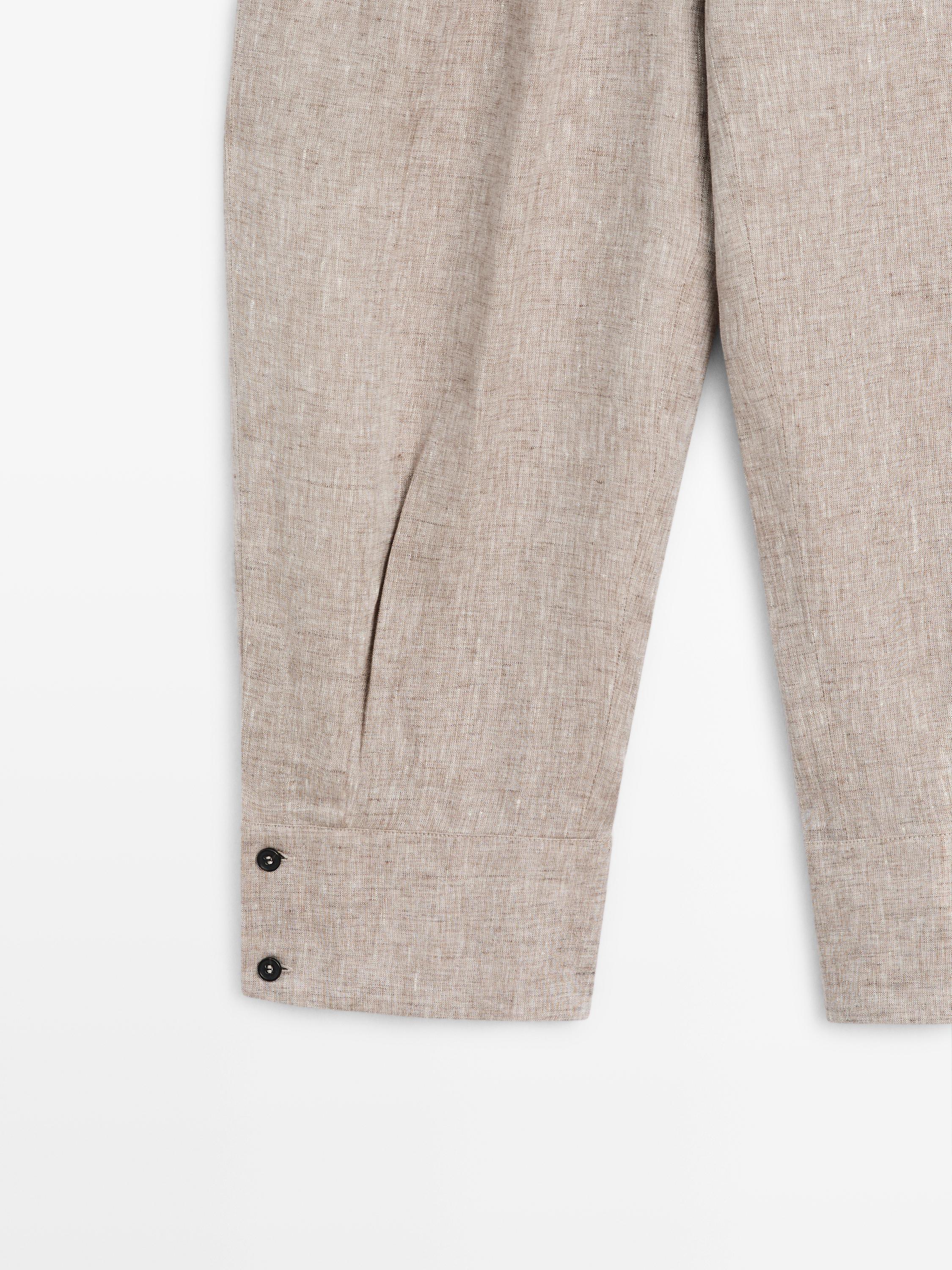 Suit trousers with buckle detail