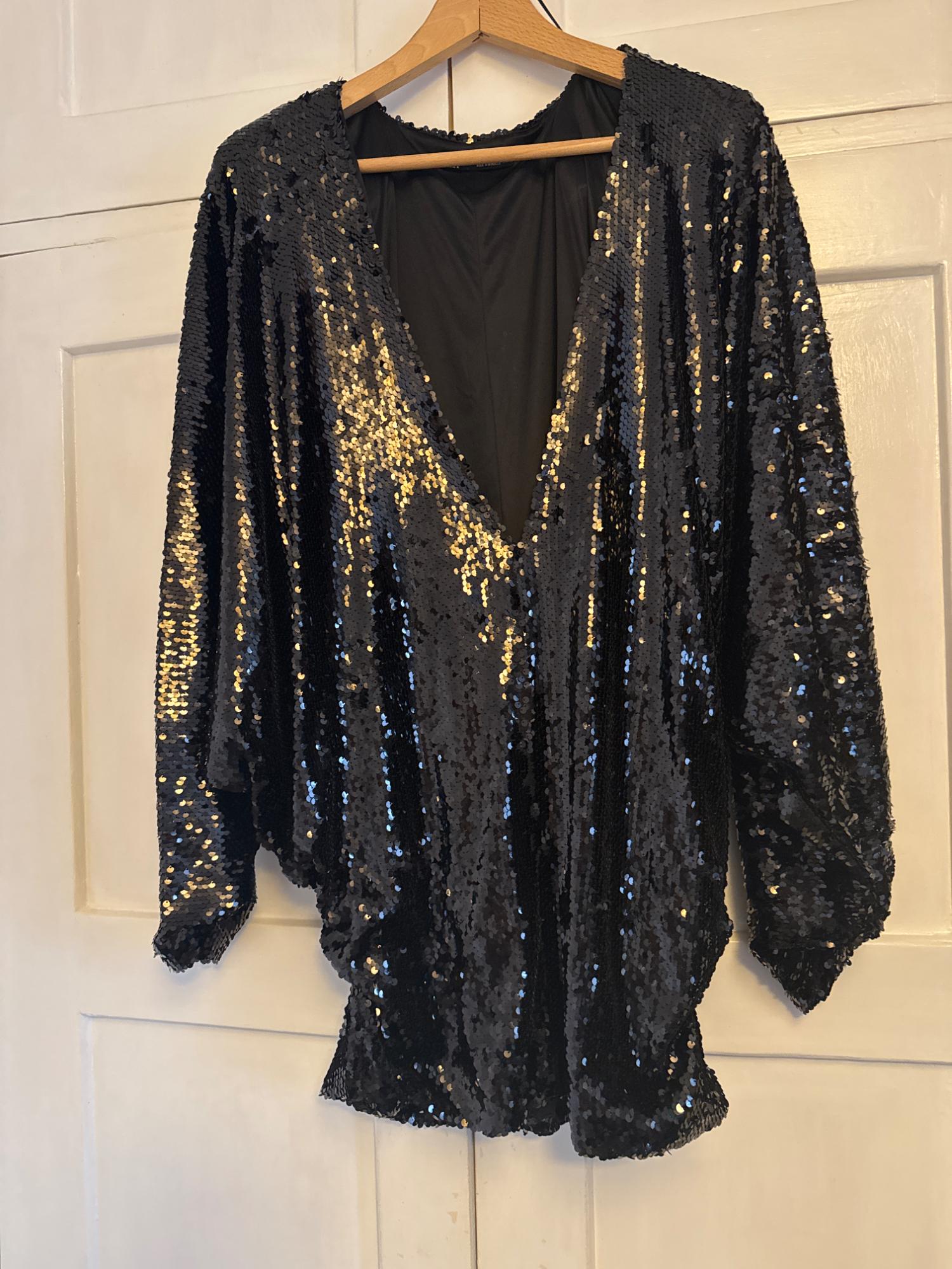 SEQUIN DRESS WITH A PLUNGING NECKLINE