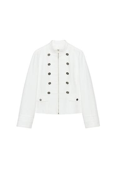Front view of an blazer with a raised collar, decorative metal buttons, faux flap pockets, and a front zip fastening.