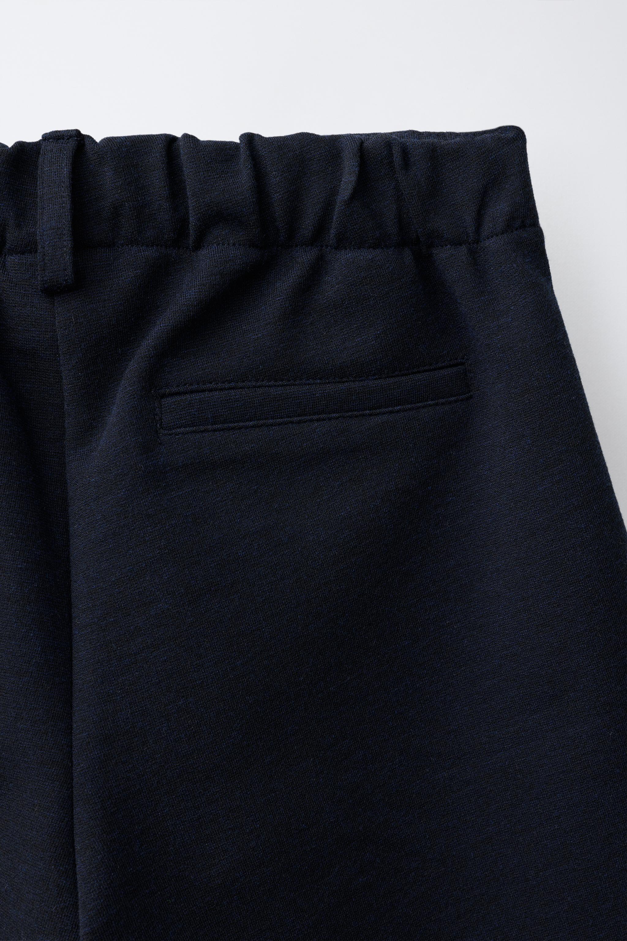LONG PLEATED SHORTS