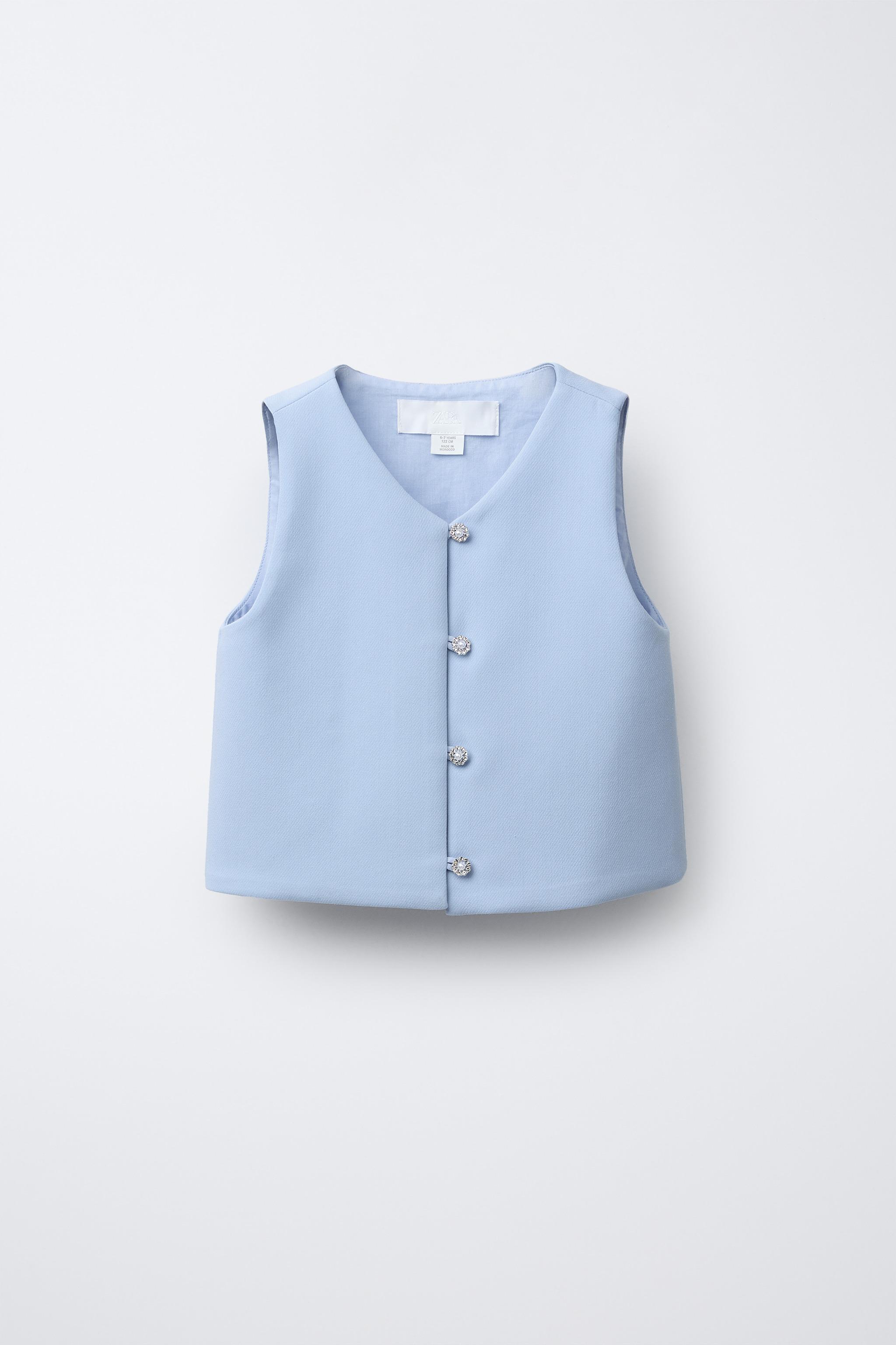 TOP AVEC BOUTON BIJOU