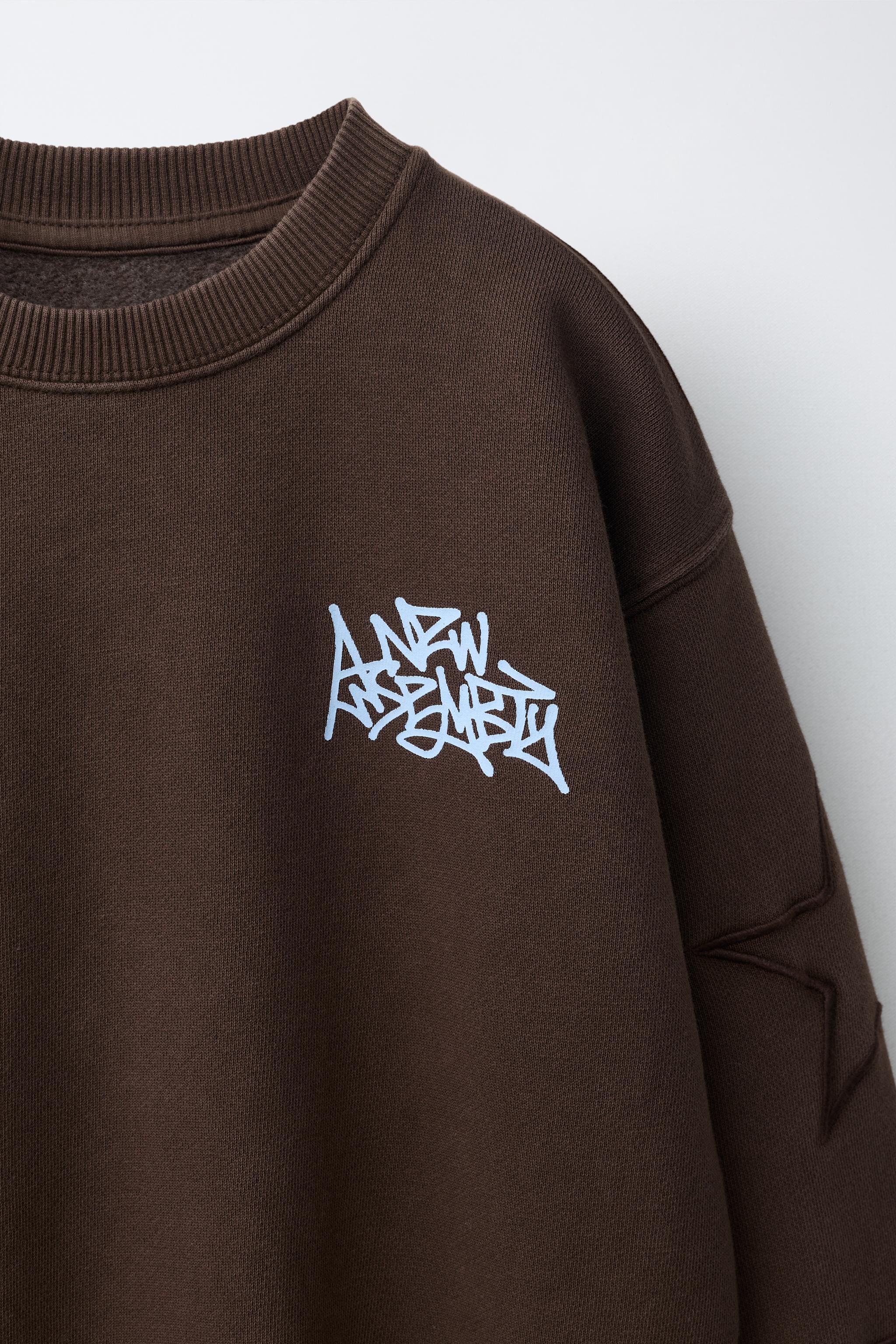 EMBROIDERED STAR TEXT SWEATSHIRT