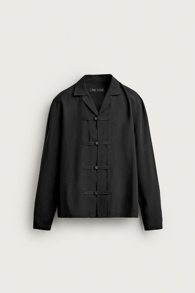 Camisa fluida alamares tejido