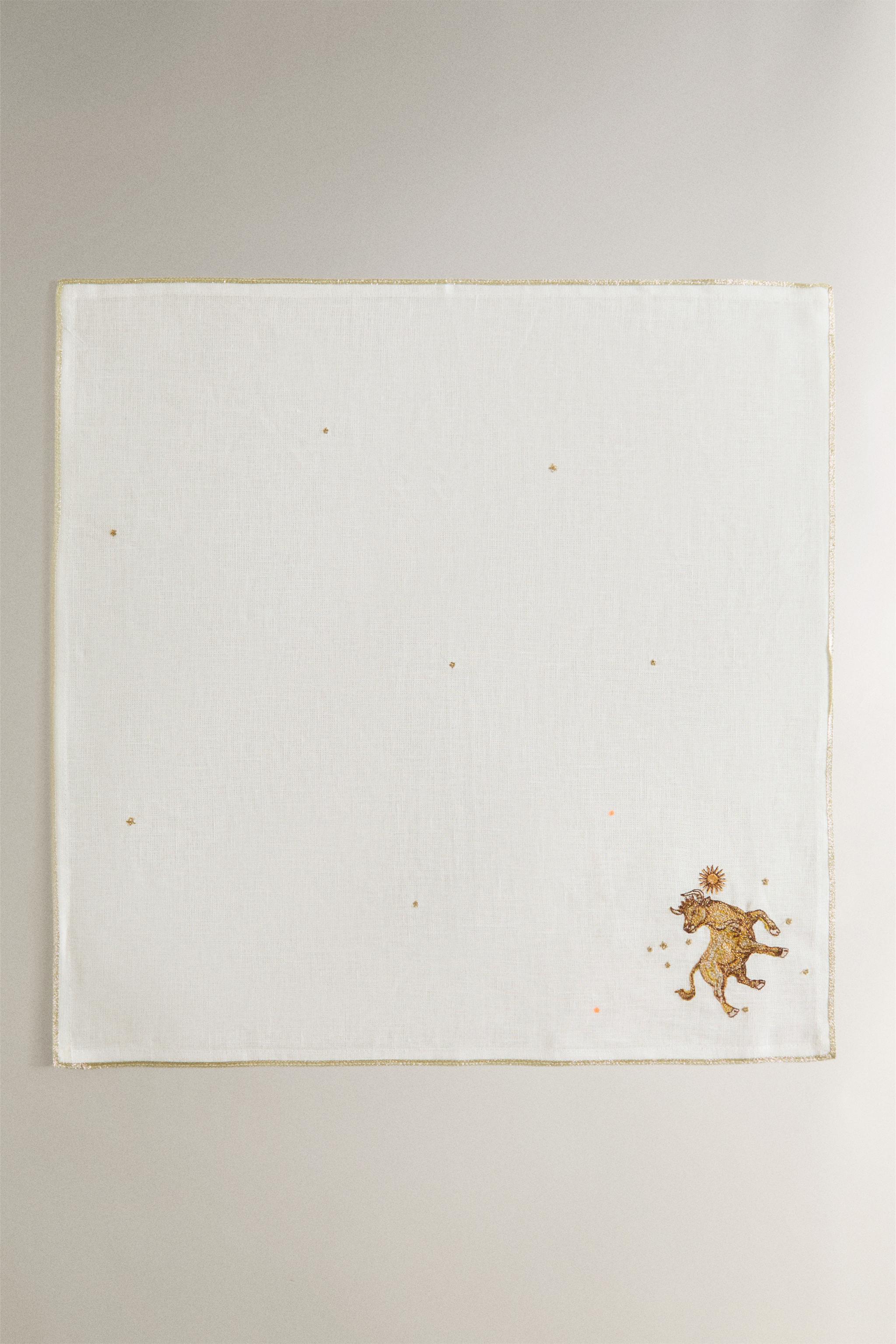 EMBROIDERED TAURUS LINEN NAPKIN | MARISA BERENSON — Ecru