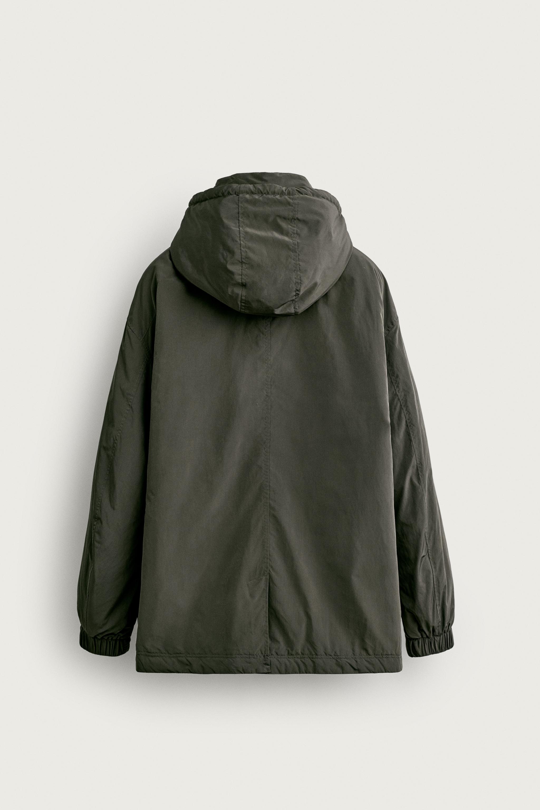 BLOUSON TECHNIQUE À CAPUCHE DÉPERLANT