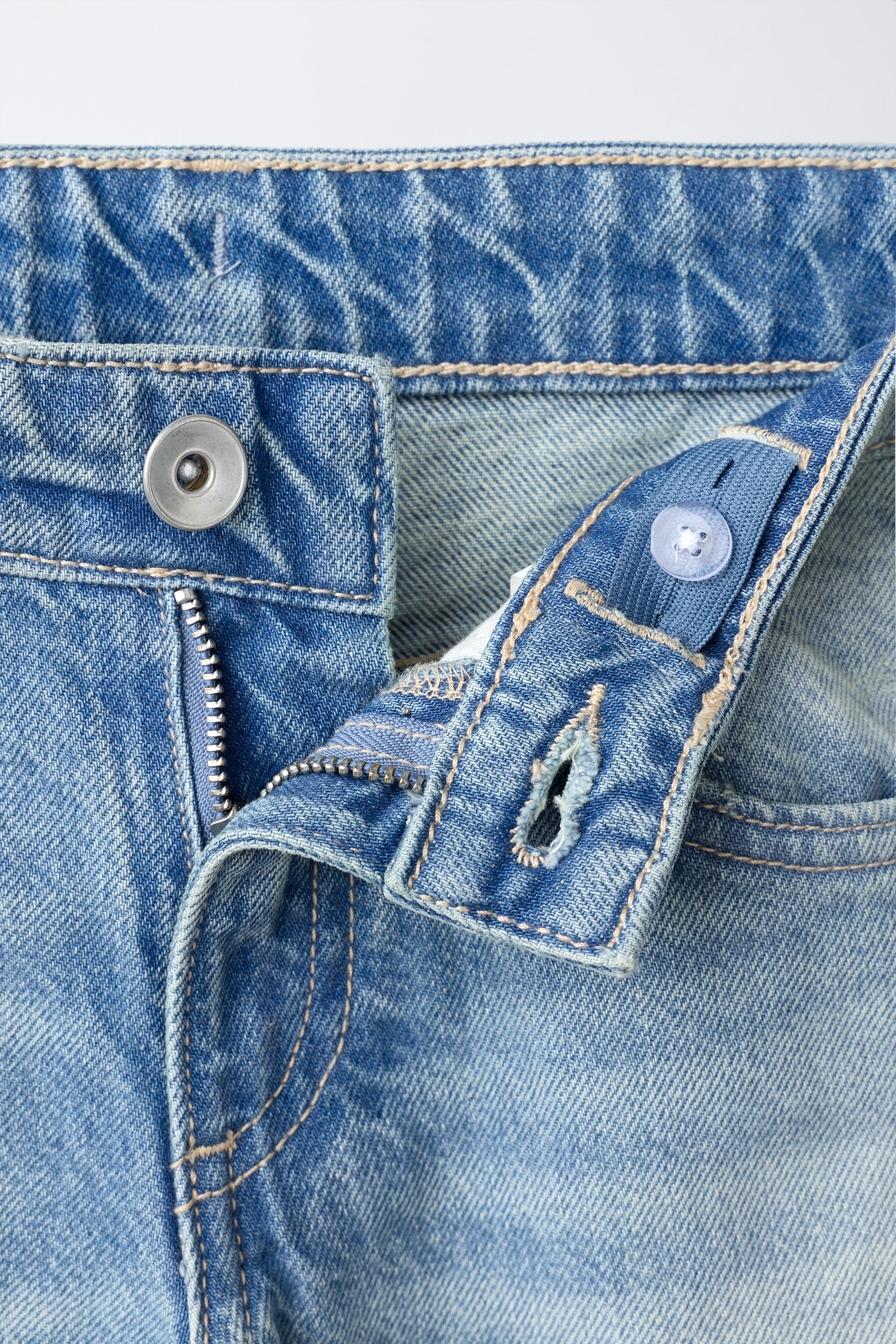 RIPPED STUDDED FLARE JEANS