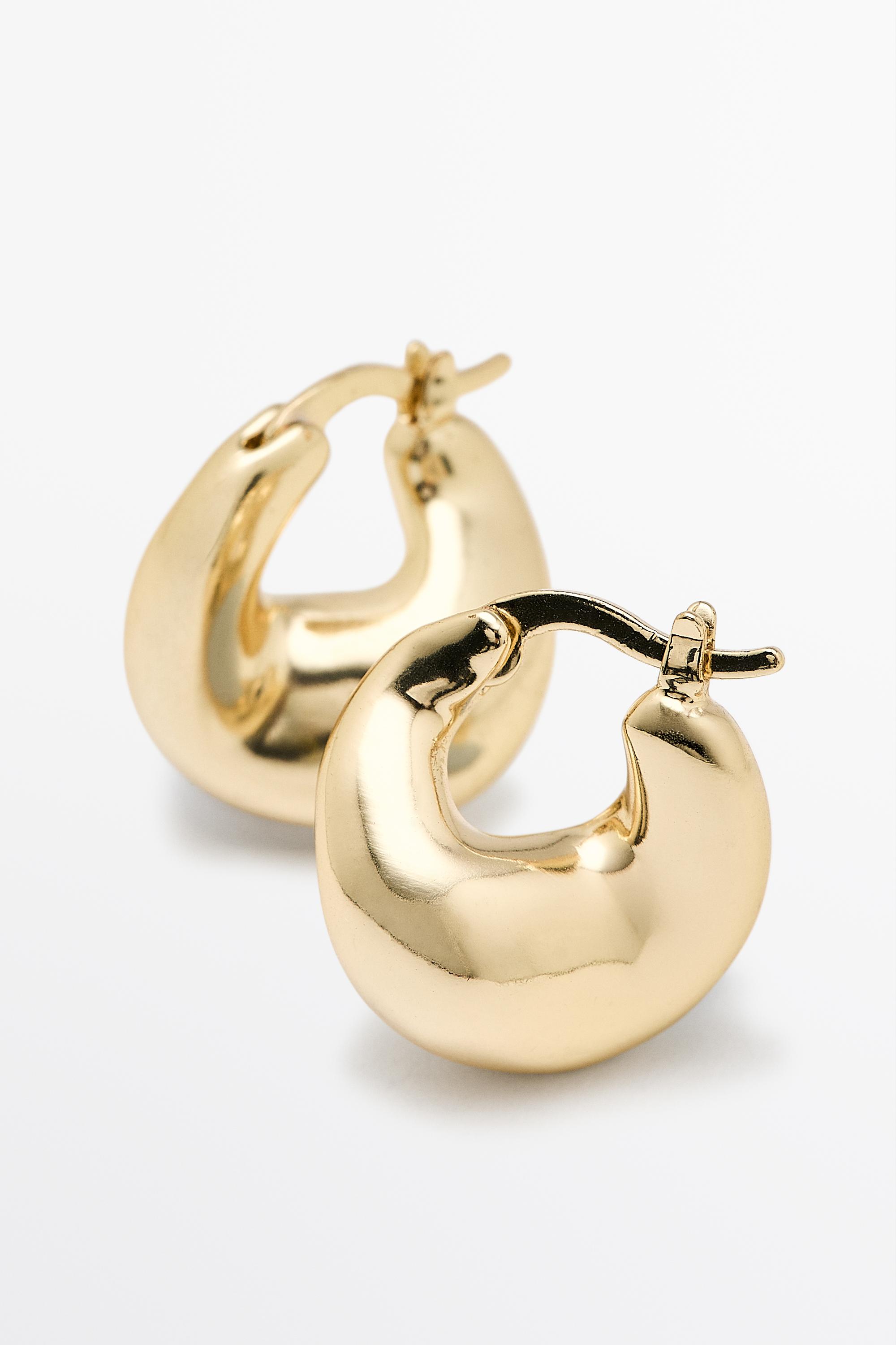 Voluminous hoop earrings — Golden