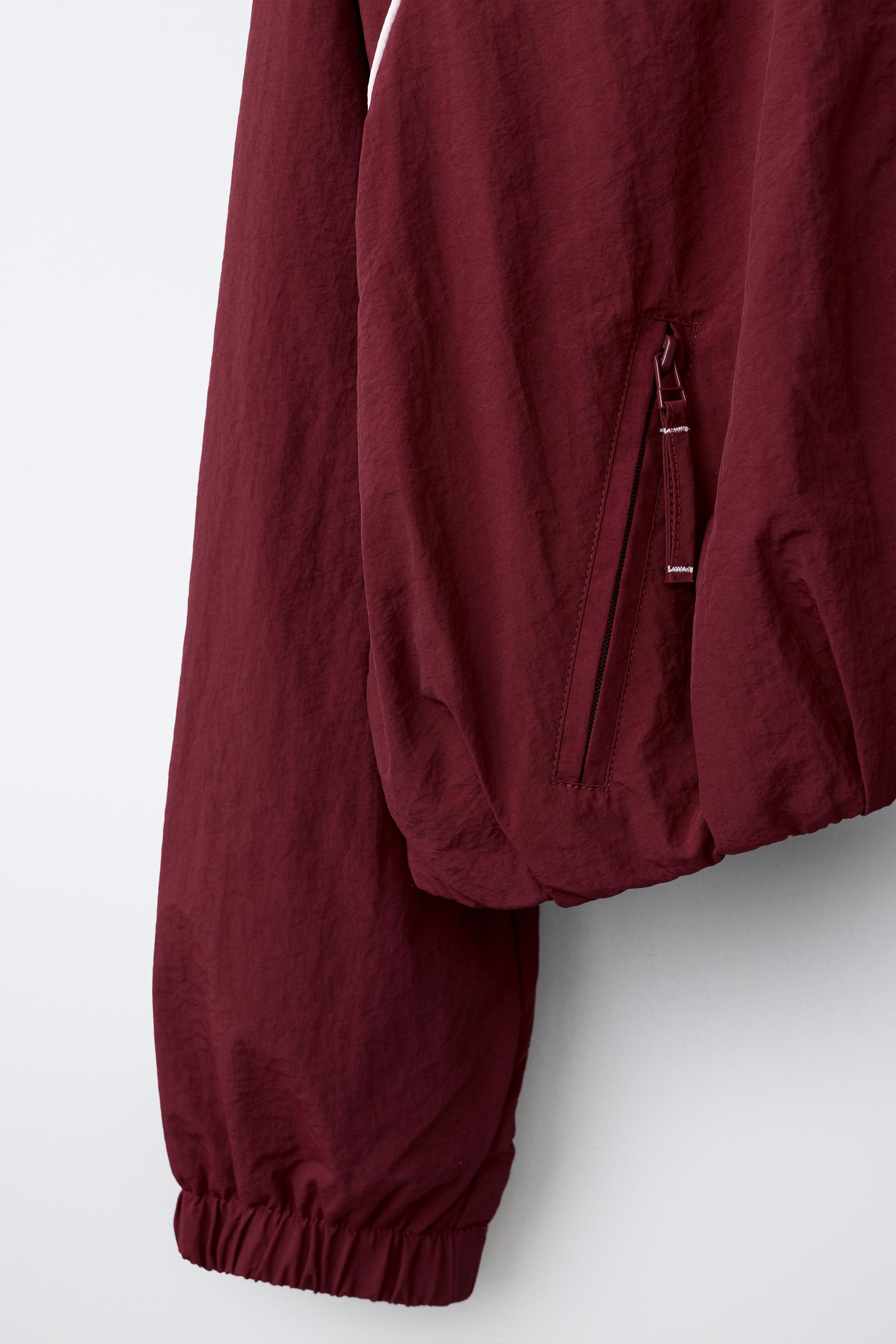 BLOUSON SPORT À LISERÉS CONTRASTANTS