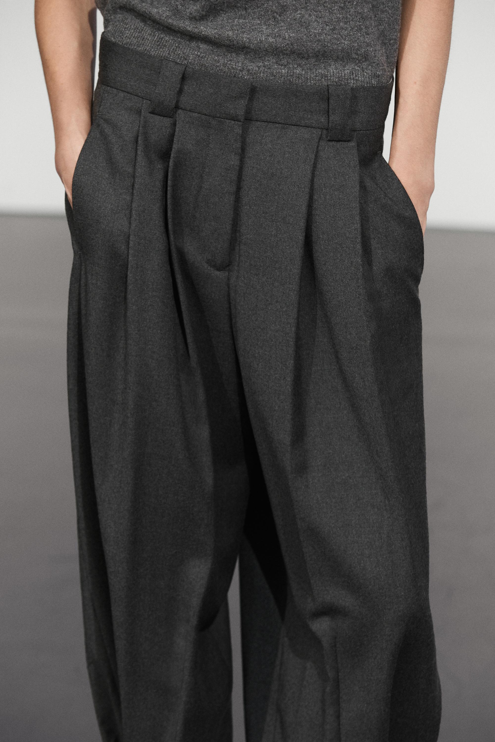 Pantalon flanelle à plis et détail bas