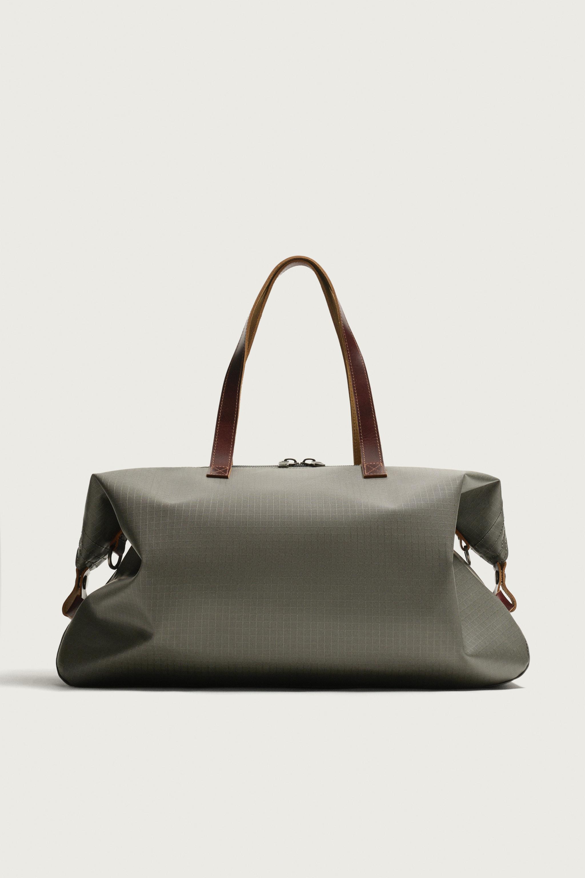 LEATHER-DETAIL TRAVEL BAG
