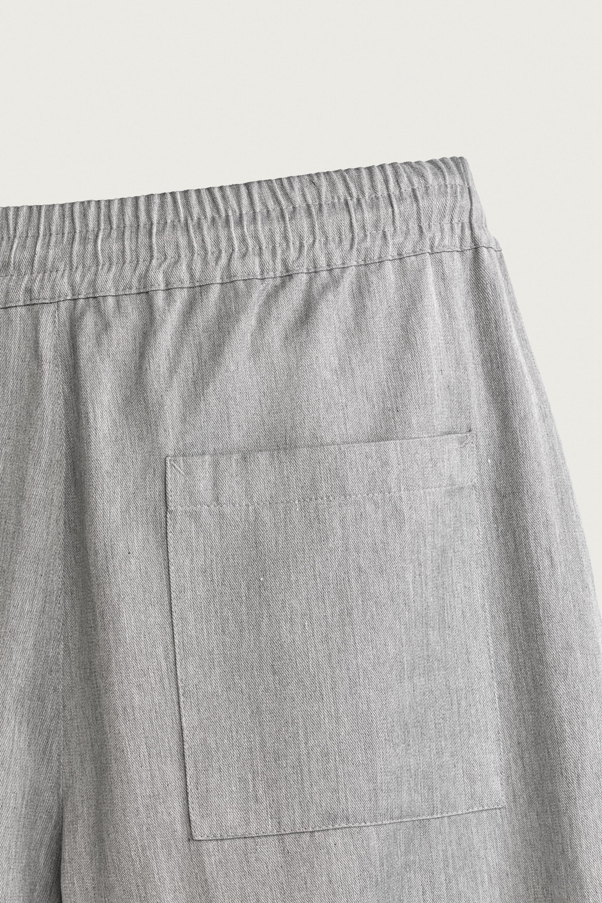 PANTALON BALLOON FIT À PLIS LATÉRAUX
