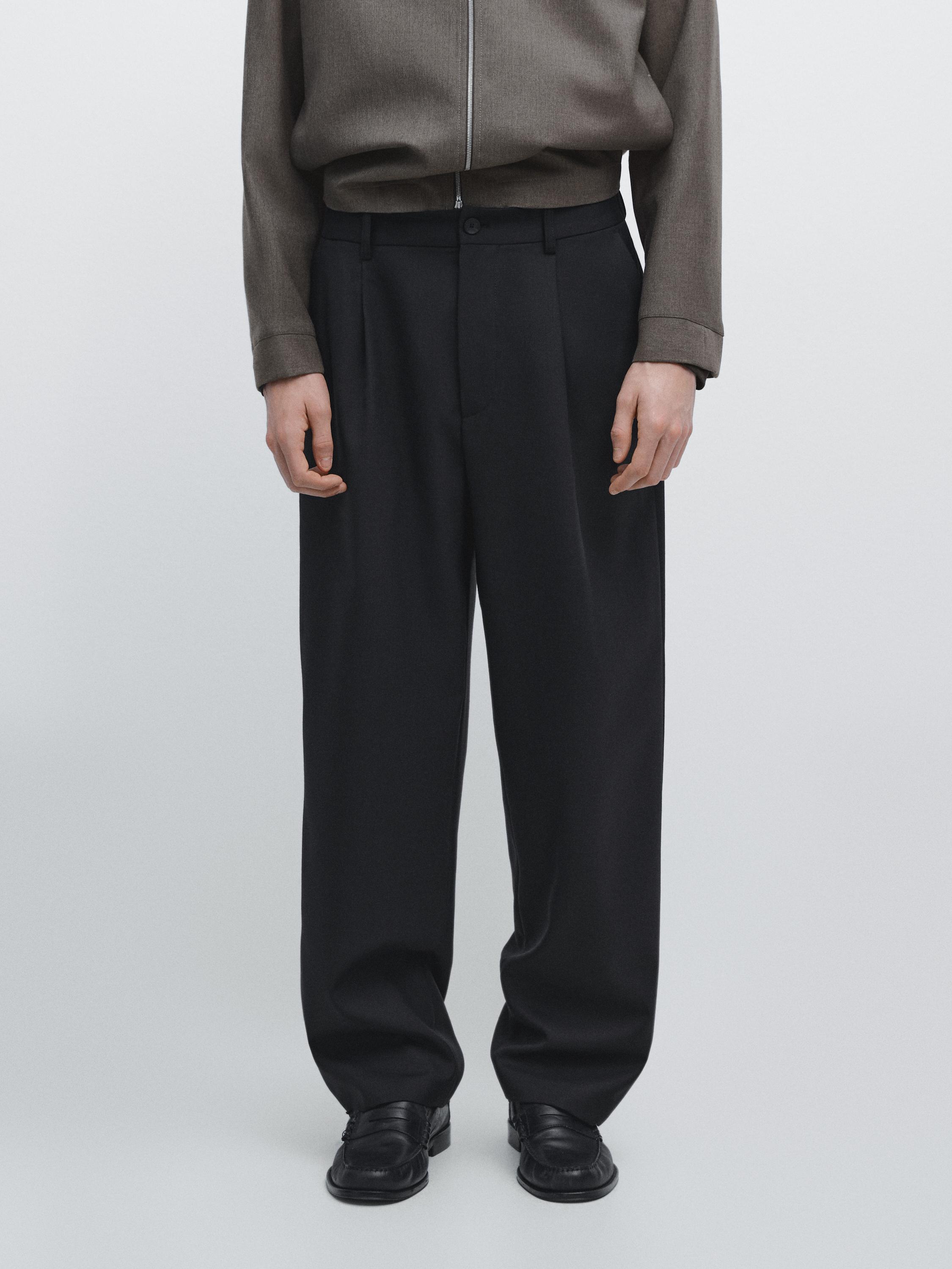 Pantalon relaxed fit à pinces en laine mélangée