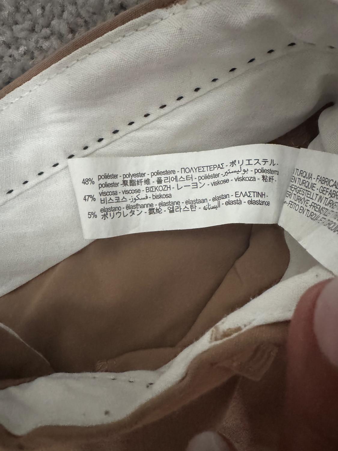 Detail of interior label with composition information in several languages.