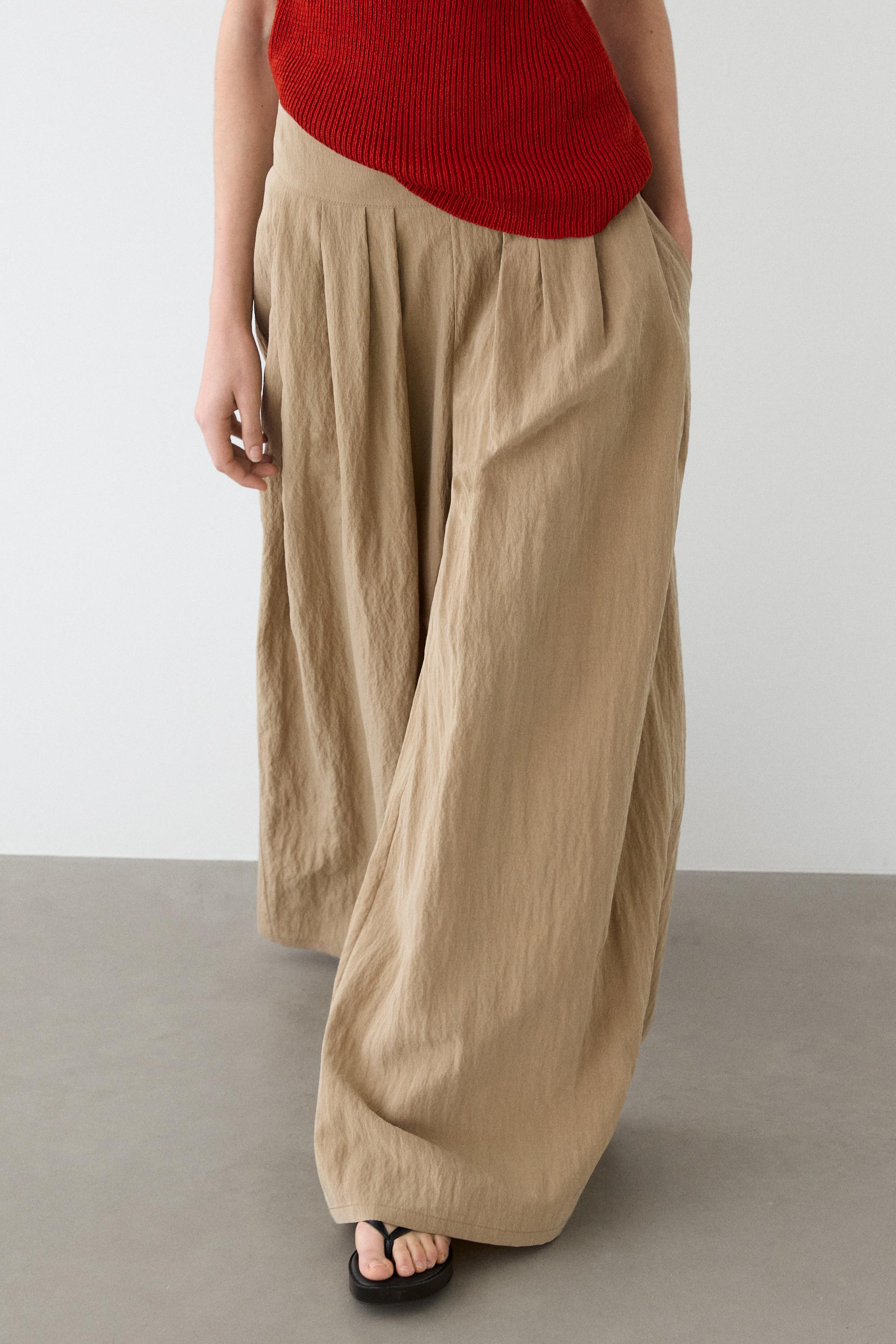 Palazzo trousers with box pleats