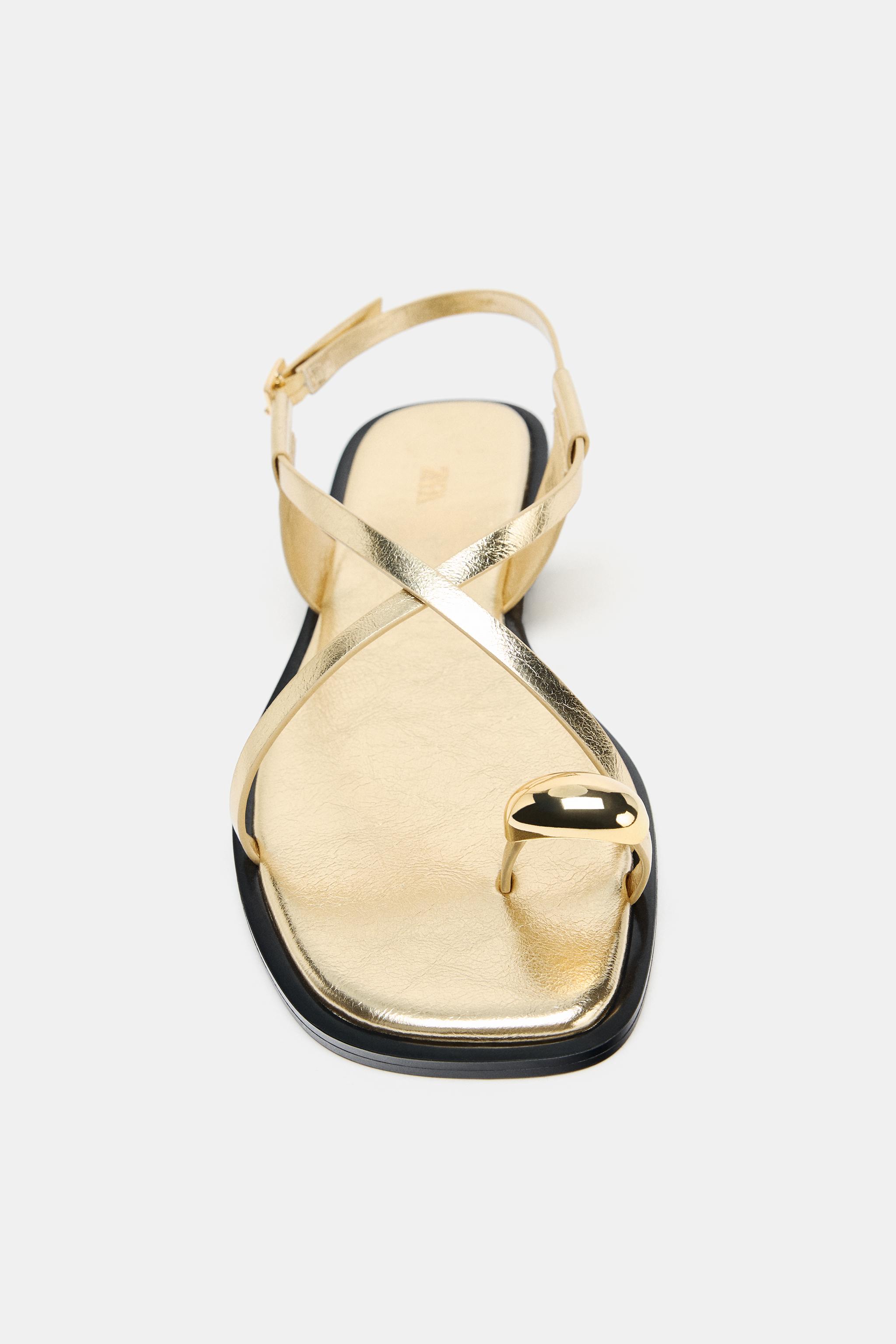 FLAT SANDALS WITH METALLIC DETAIL STRAPS