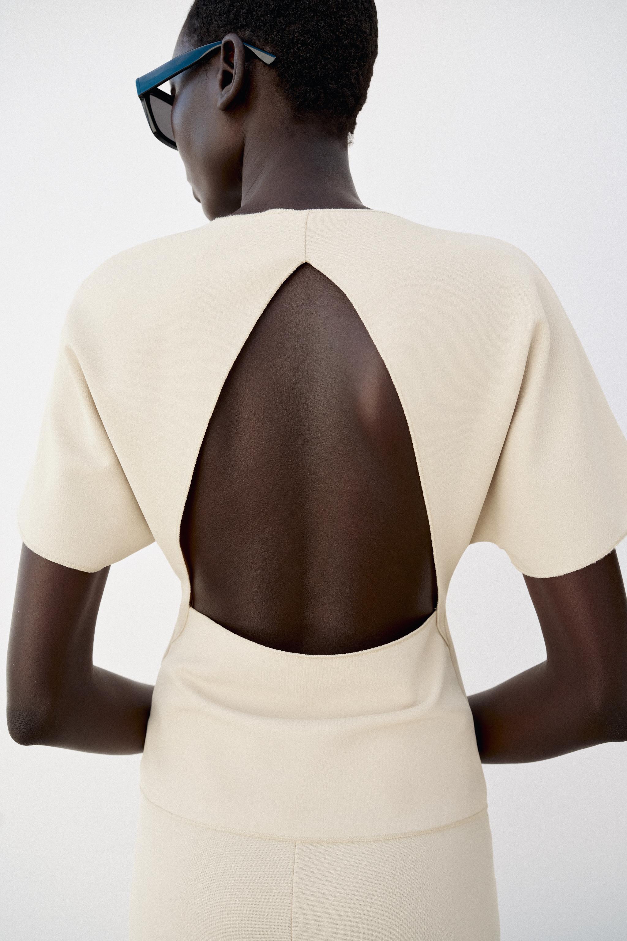 SHORT SLEEVE CUT OUT TOP