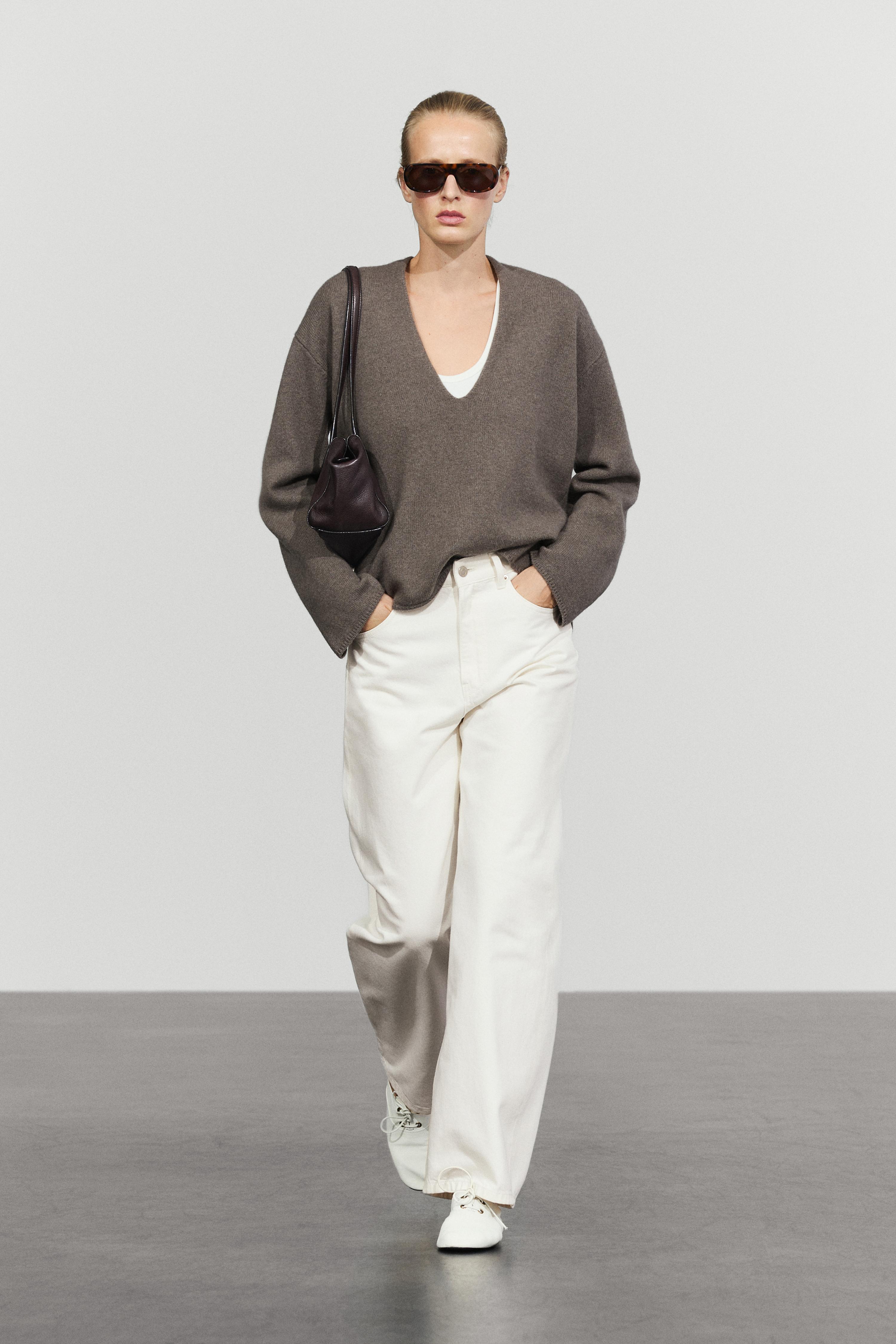 Long-line knit sweater with neckline detail