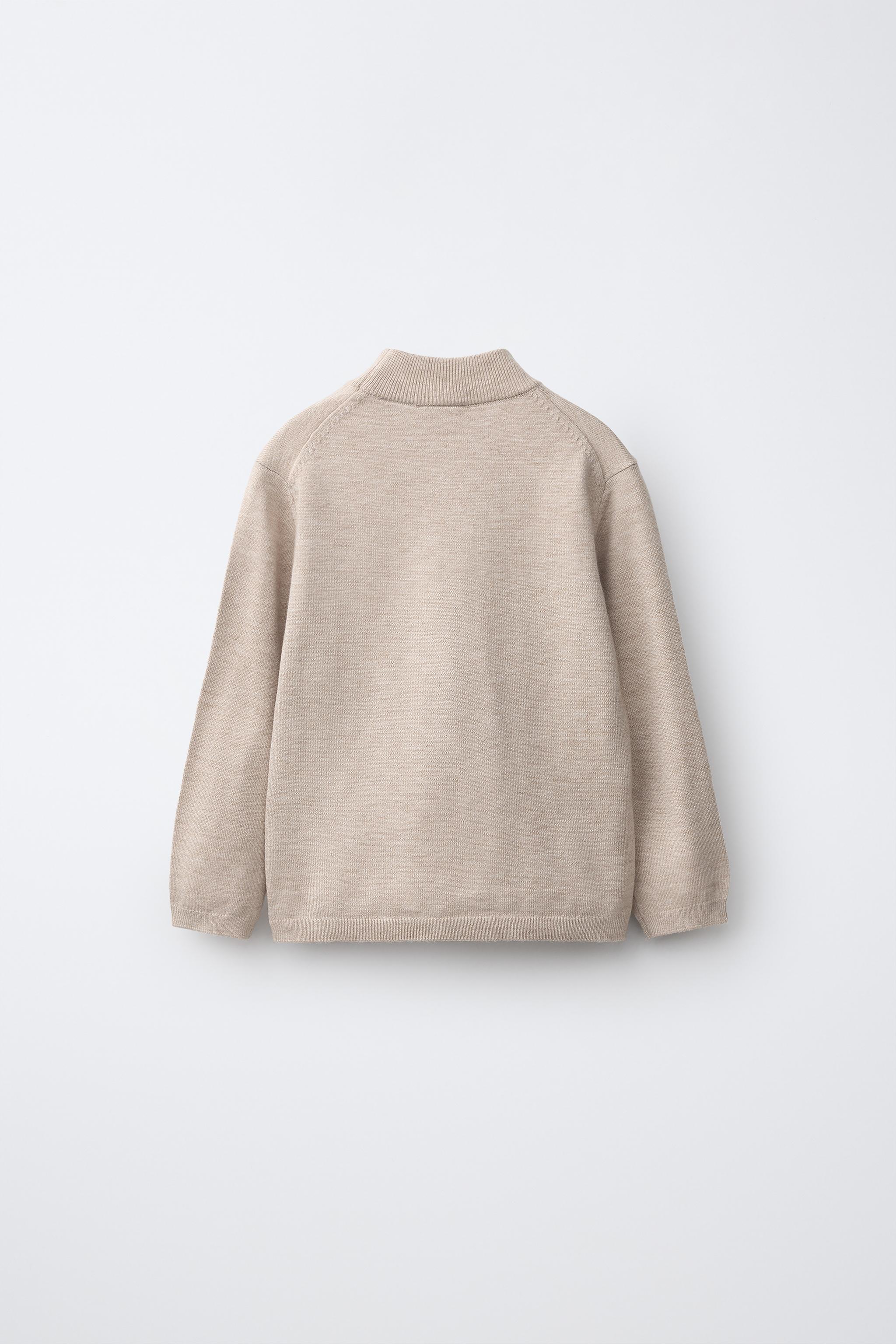 PULL EN MAILLE À COL CHEMINÉE