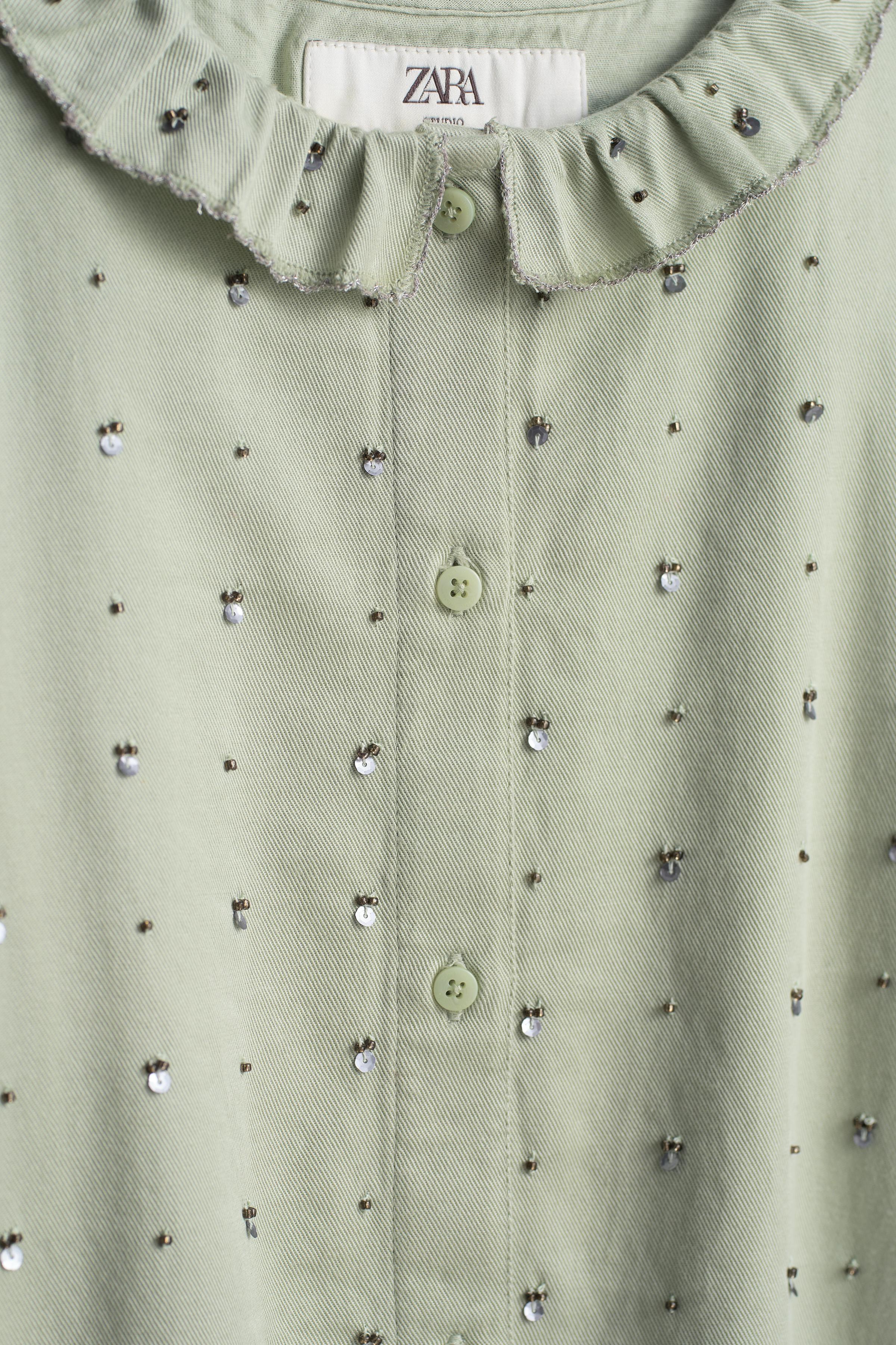 LIMITED EDITION SEQUIN RUFFLE NECK BLOUSE