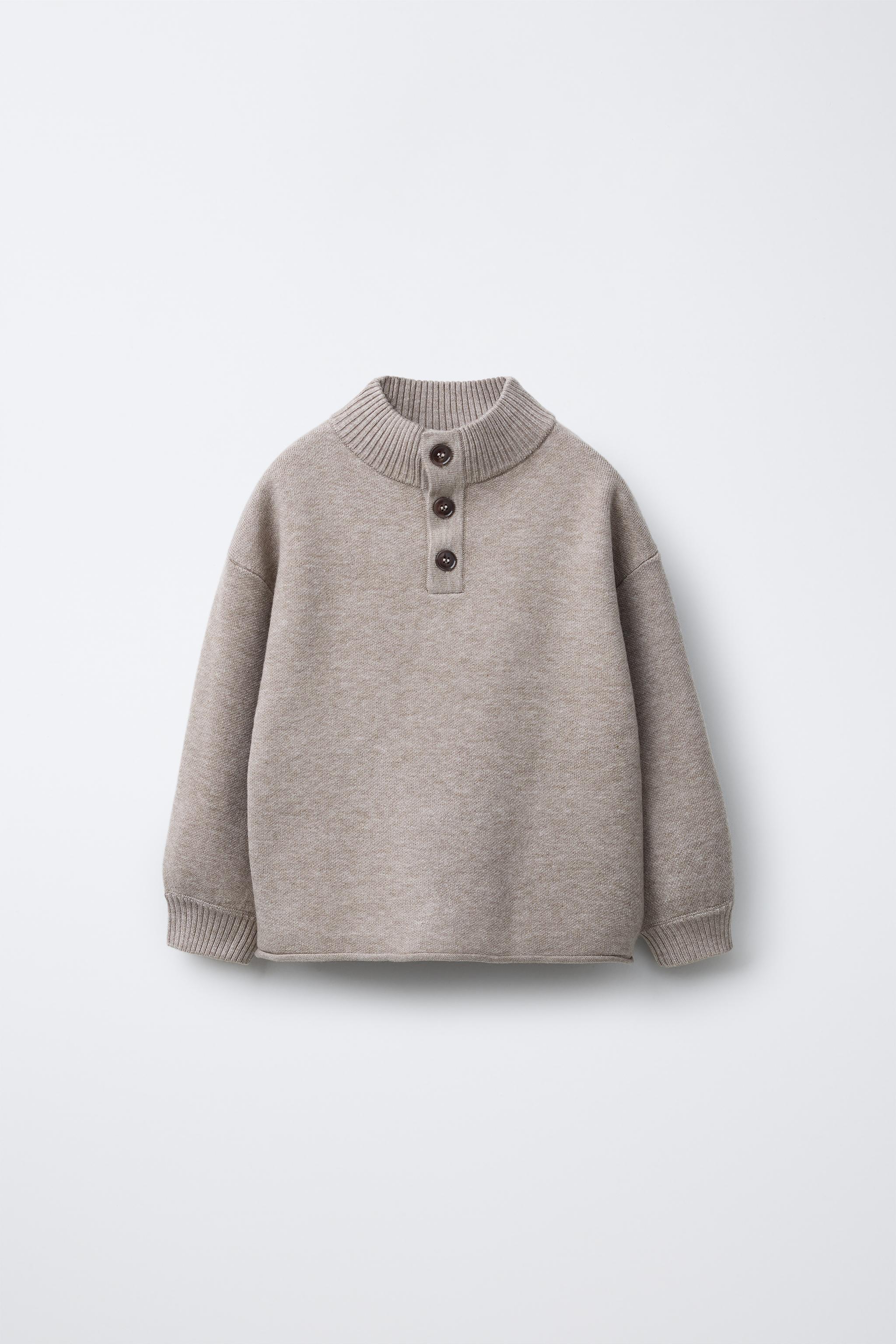 BUTTON KNIT SWEATER