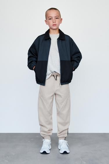 CELANA PANJANG JOGGER DENGAN RITSLETING - Putih pasir dari Zara