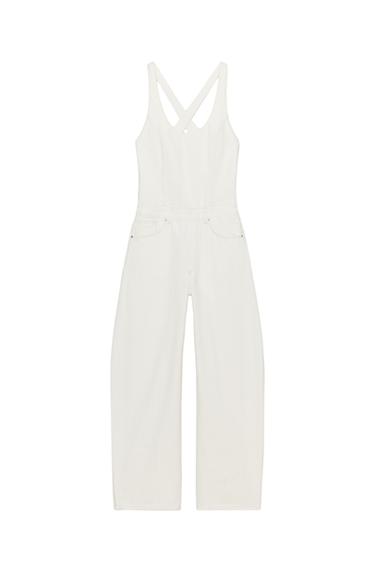 Front view of dungarees with crossed straps, a round neckline, five pockets, pronounced seams, and a straight leg.