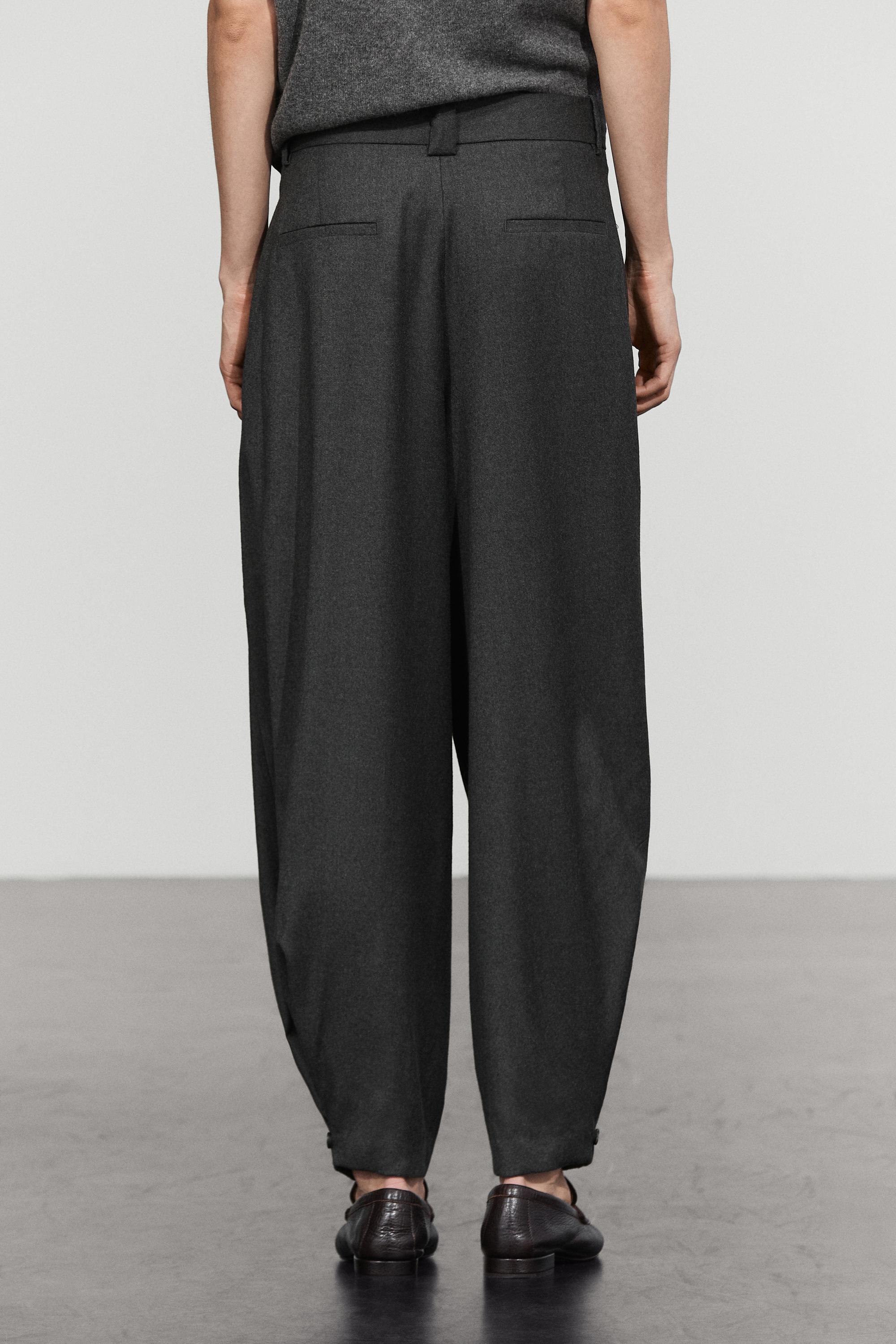 Pantalon flanelle à plis et détail bas