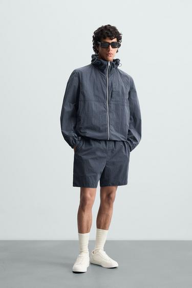 CAZADORA TÉCNICA CAPUCHA - Índigo claro de Zara - Imagen 0