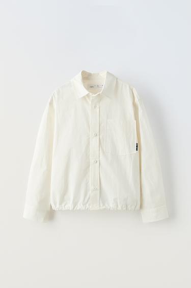 قميص بحافة سفلية قابلة للتعديل - أبيض الخاص بـ Zara