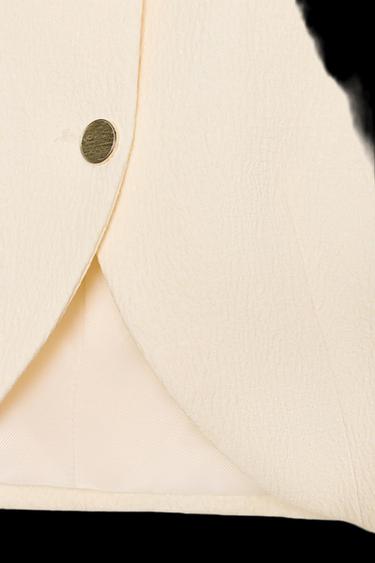 BLAZER CORTA MANGA ABULLONADA - Blanco roto de Zara