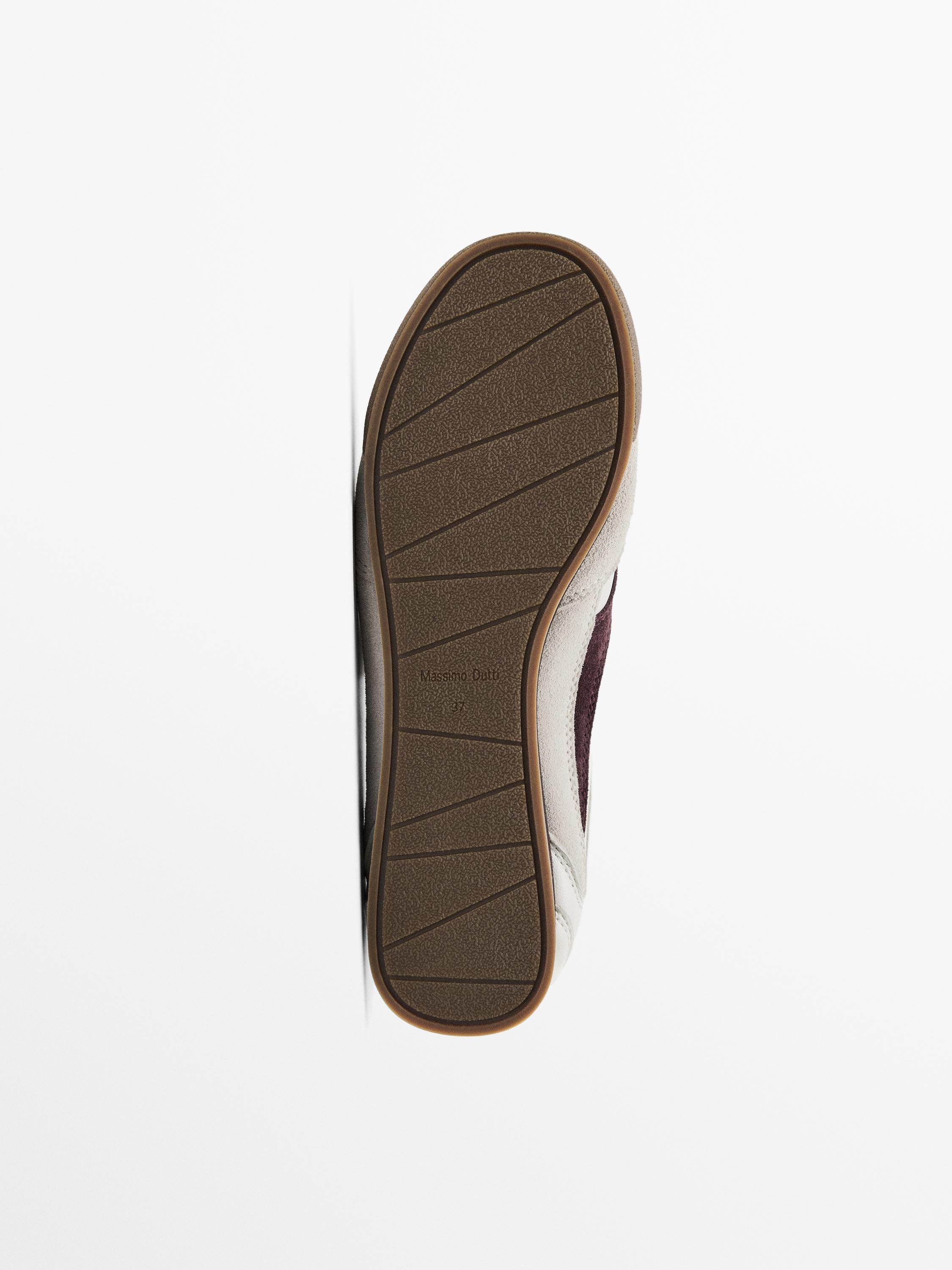 Tennis cuir contrastant