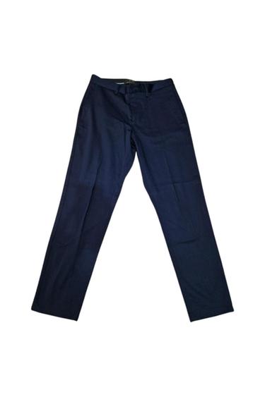 Front view of navy blue trousers with side pockets and a zip fastening.