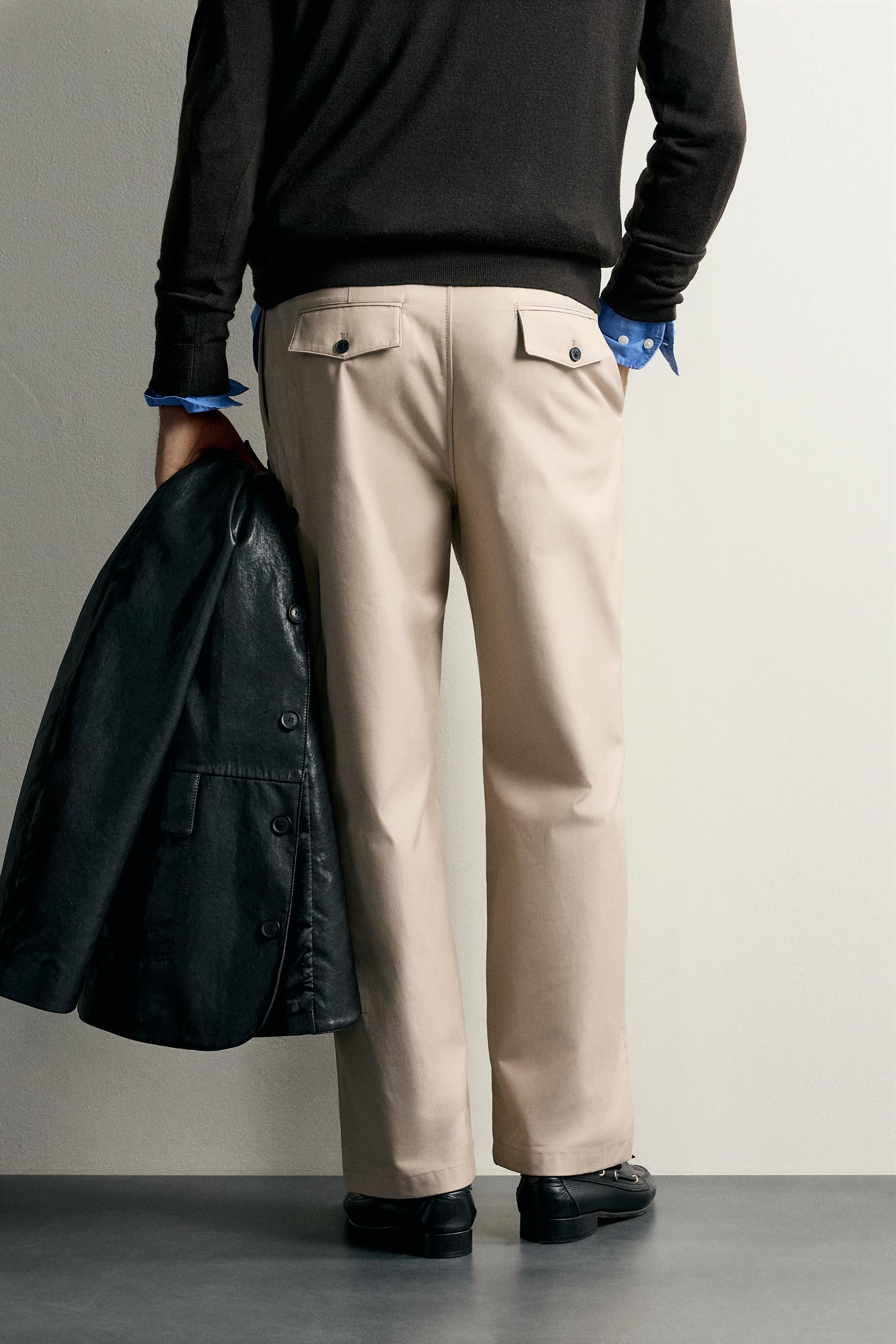 STRAIGHT FIT PLEATED PANTS
