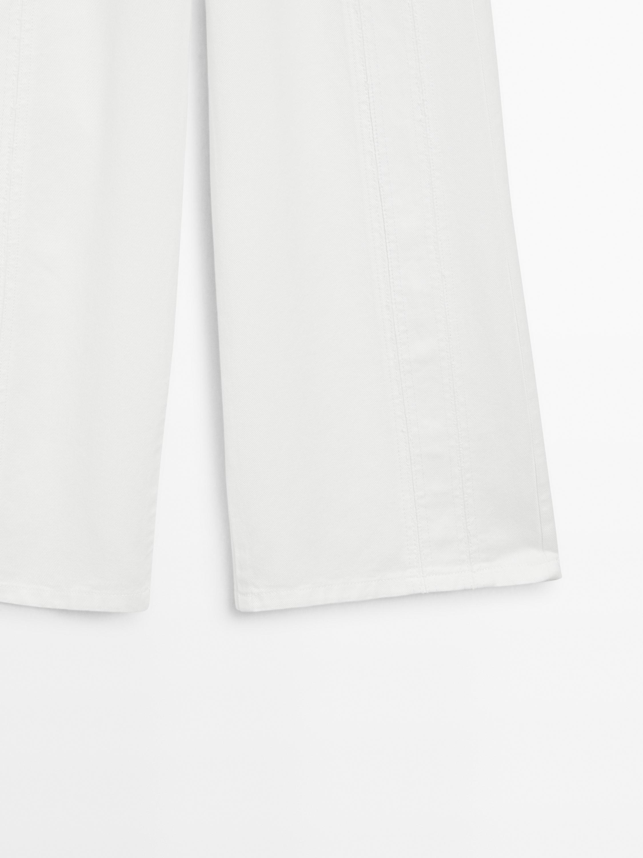 Jean wide leg taille haute avec découpes