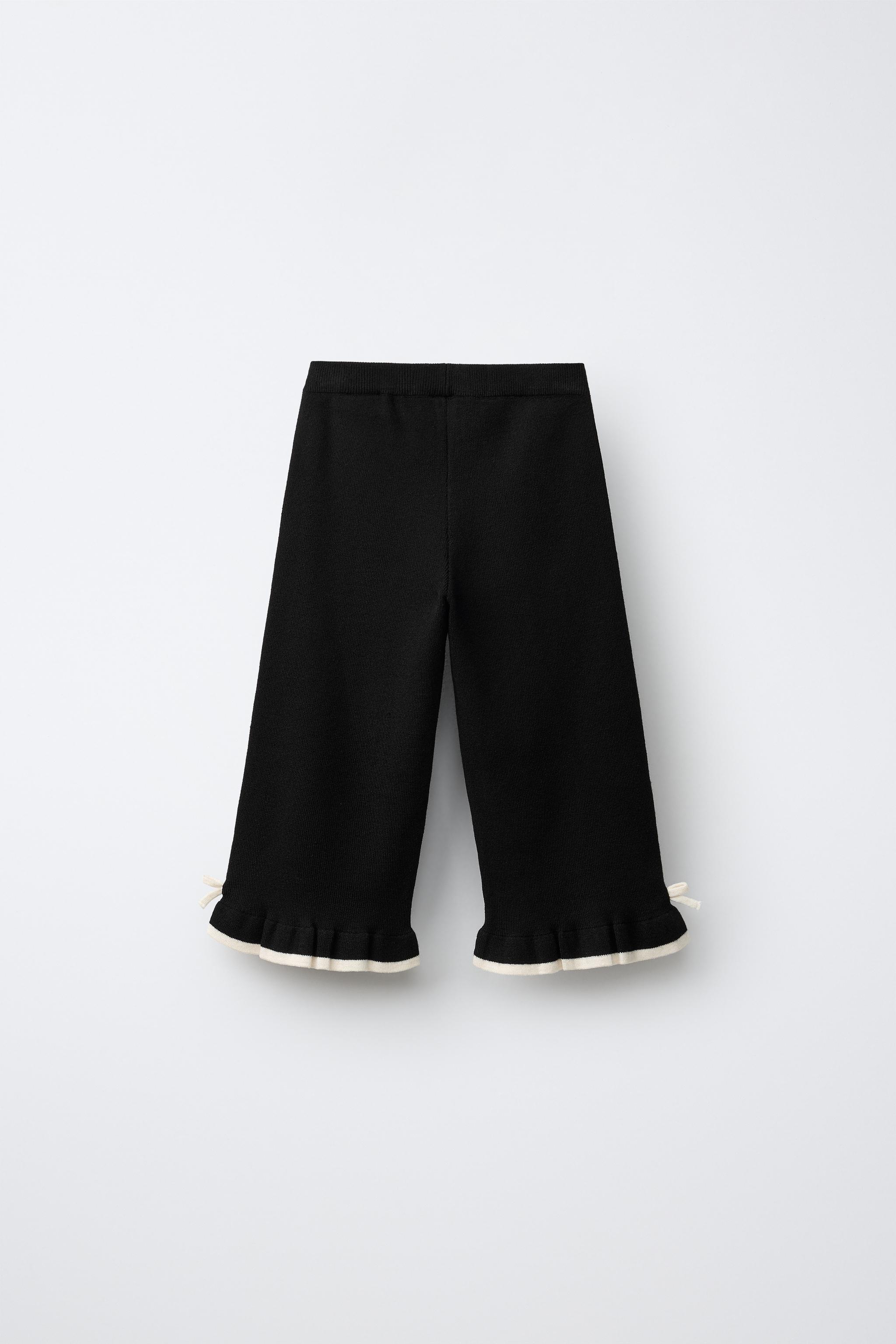 FLARED KNIT PANTS WITH BOWS AND RUFFLE — Black
