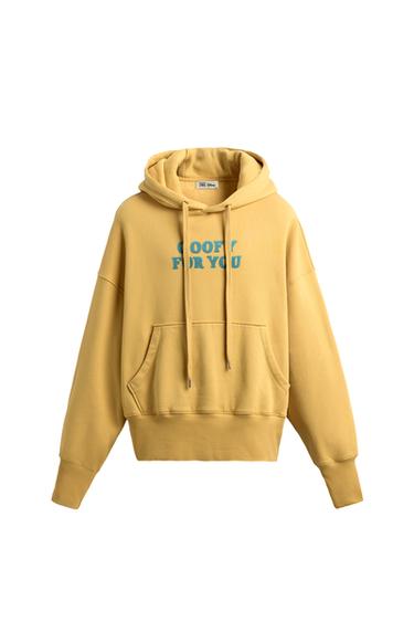 Front view of a yellow hooded sweatshirt, with the text "GOOFY FOR YOU" on the chest and a front kangaroo pocket.