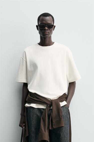 T-SHIRT WITH CONTRAST TEXTURED PATCH - White by Zara - Image 1