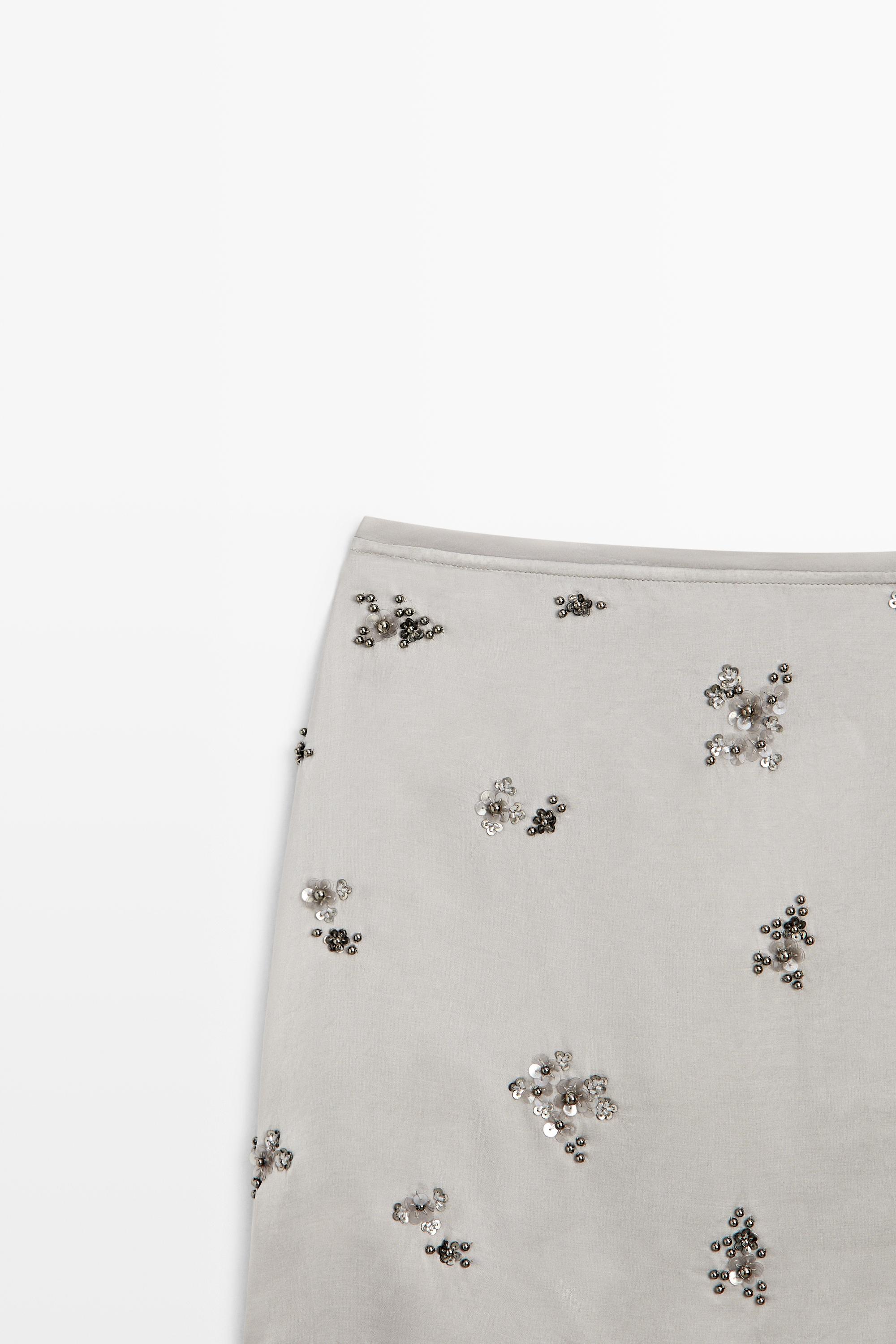Mini skirt with beaded detail