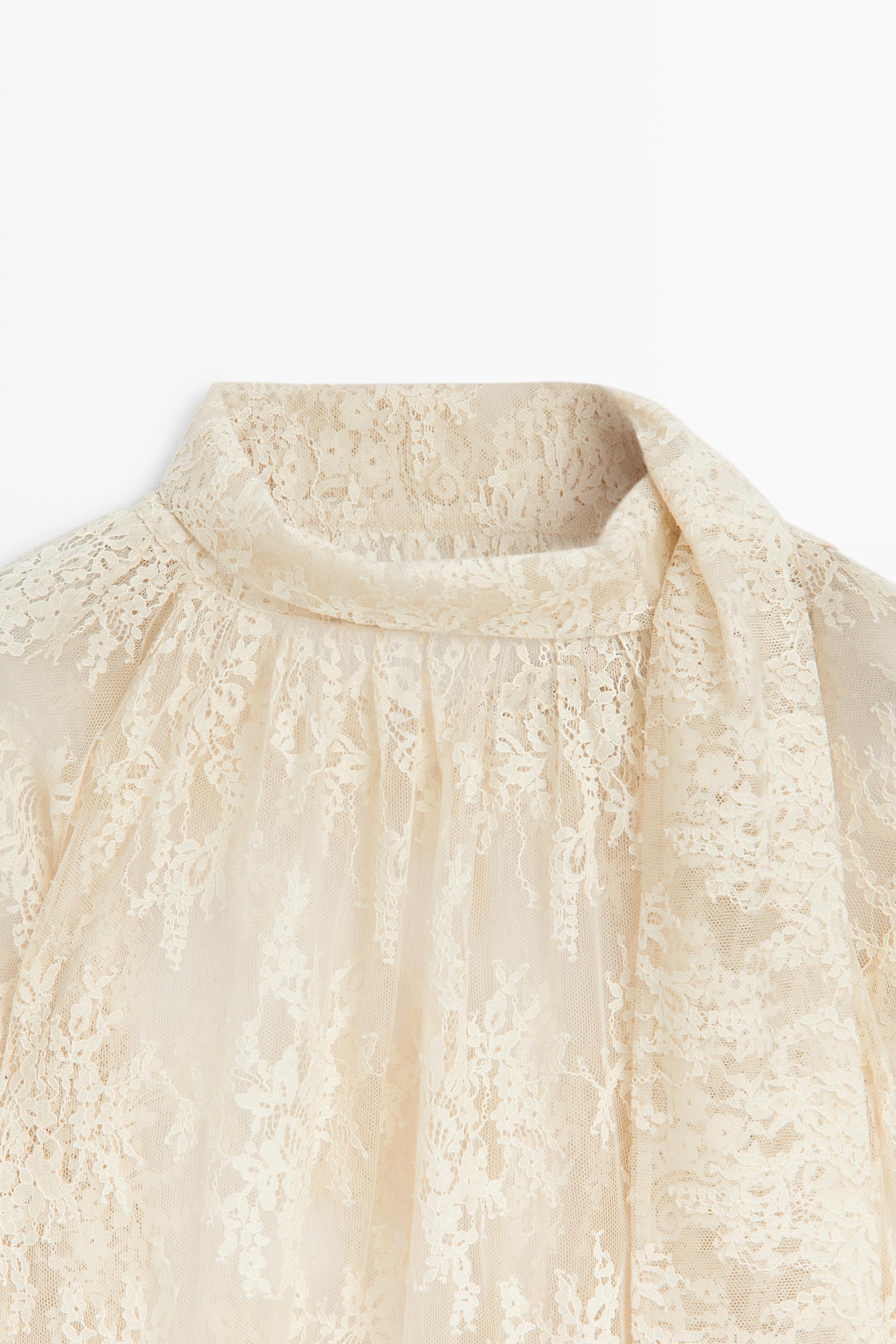 Flowing lace blouse with tie