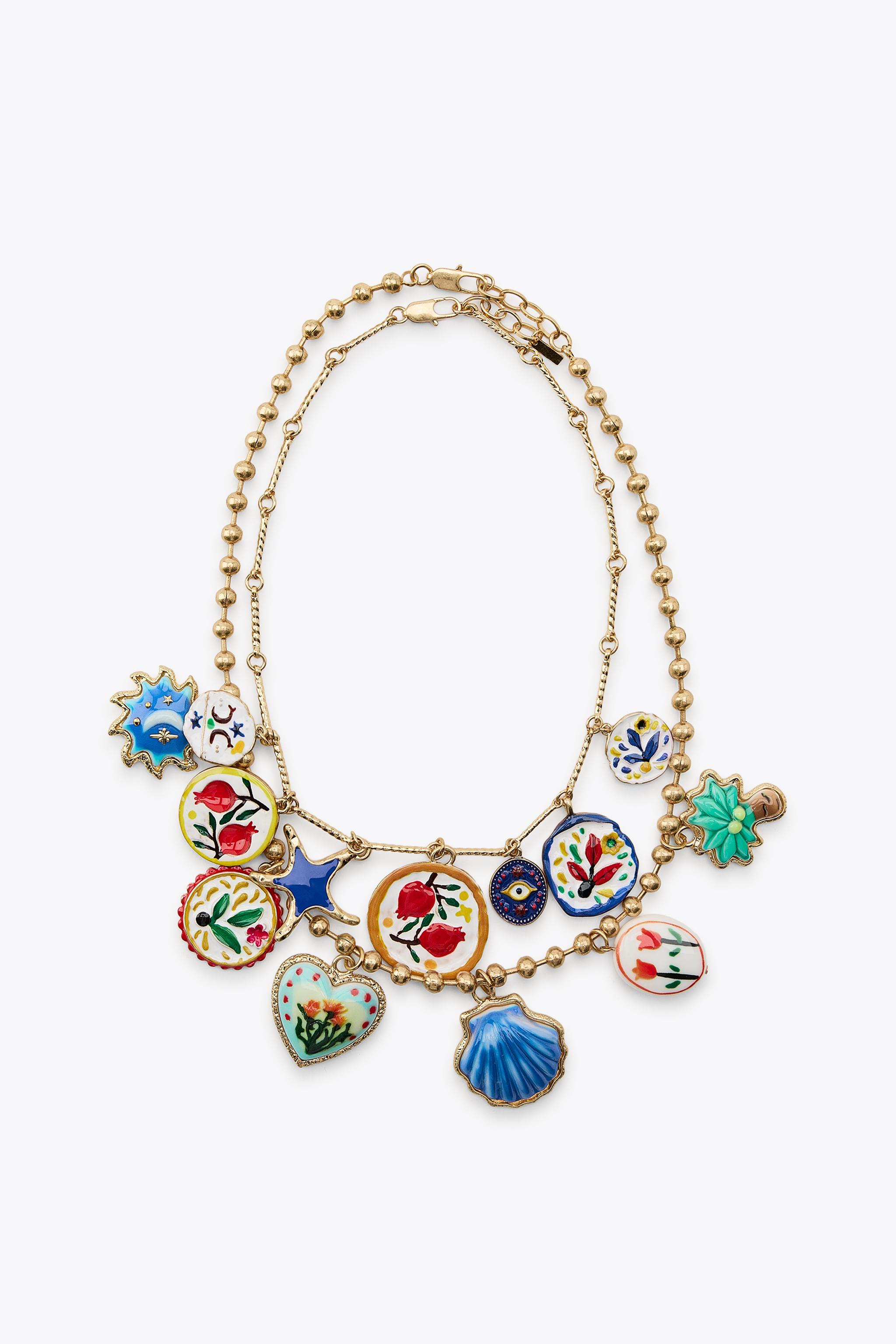 LOT DE 2 COLLIERS PALMIER FLEURS RÉSINE