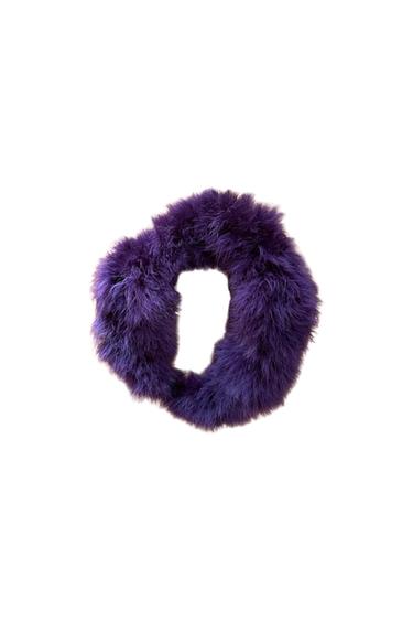 Front view of a purple circular scarf with a fluffy texture.