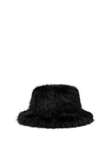 Front view of a black bucket hat with a fur application and a wide brim.