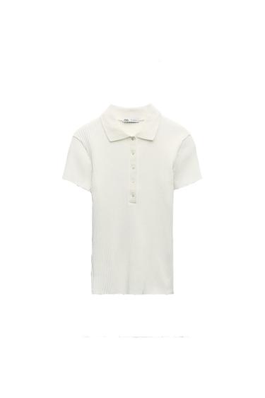 White short-sleeved ribbed polo shirt, with a classic collar and front buttons, on a white background.