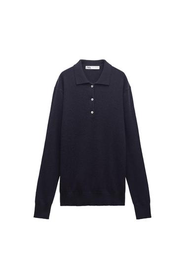 Black long-sleeved polo neck jumper with front buttons. Visible label with "ZARA" text on the collar. White background.
