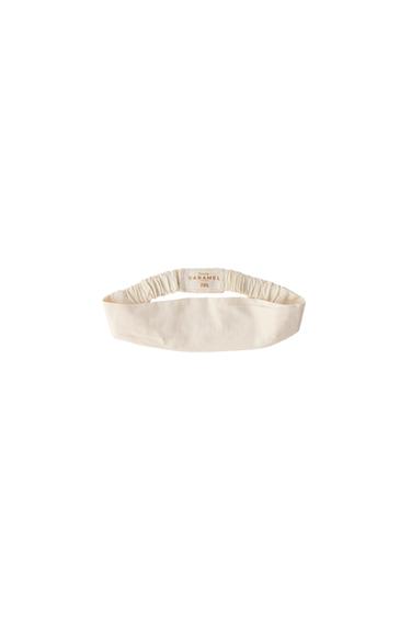 ELASTISCHES HAARBAND CREATED BY CARAMEL LONDON X ZARA - Vanille von Zara