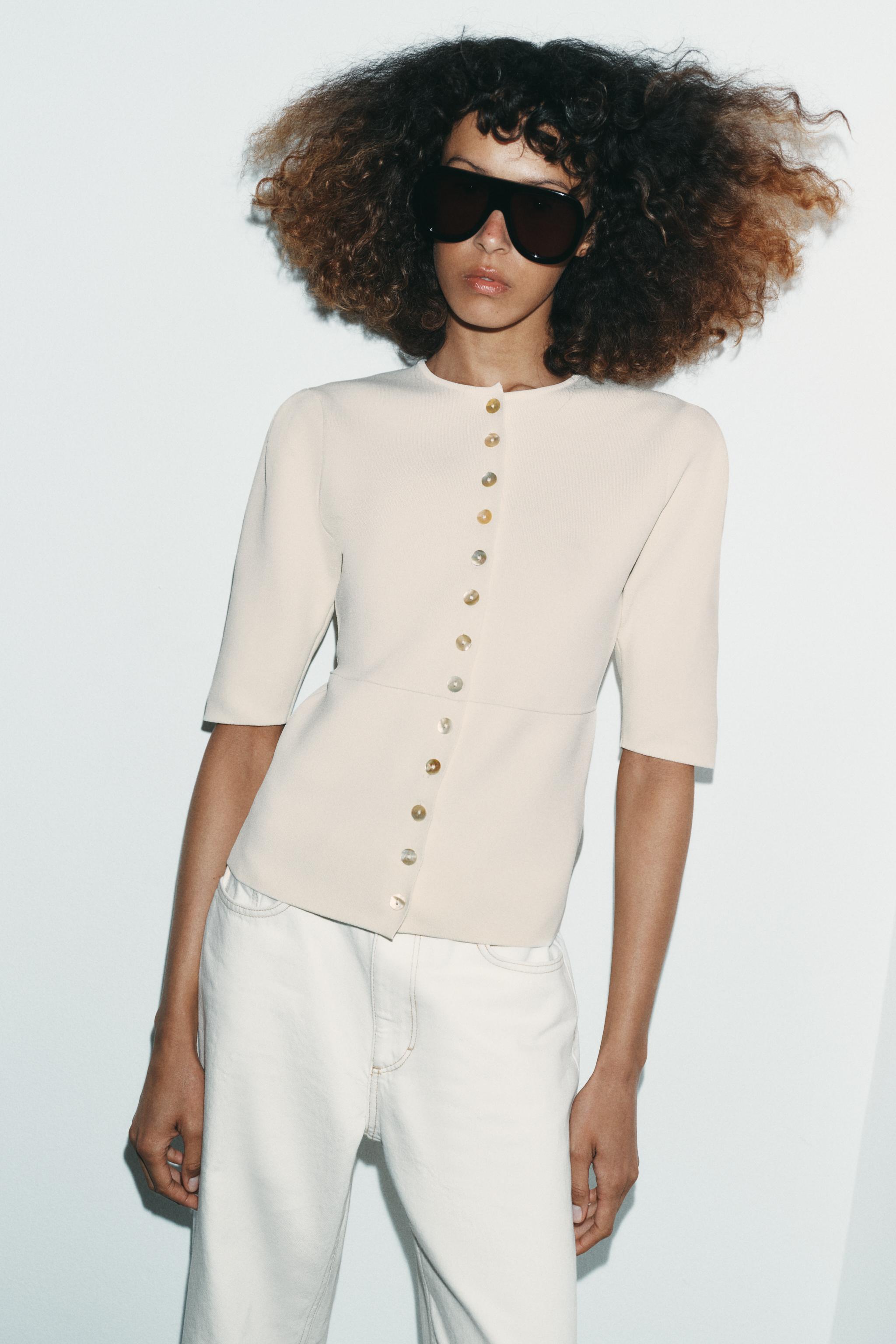 GILET EN MAILLE À MANCHES COURTES